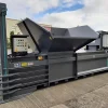 Angled front view of the CB50 Splayed Hopper in grey. A large funnel stands atop the machine for the deposit of materials.