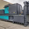 Shot of the back of the CB65X semi auto baler. It is grey and party turquoise in select back-panels.