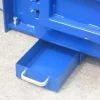 A blue drawer with a silver handle is pulled out of the bottom of a machine.