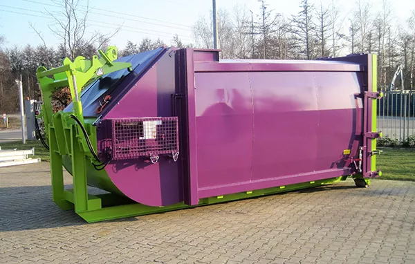 Angled side view of the purple and green RPK compactor standing outside. The bulk of the body is purple and is bordered by a bright lime green frame. The opening for waste disposal is closed.